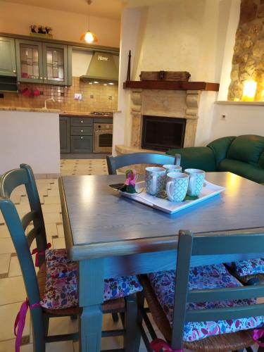 a table with a plate of food on it in a kitchen at Casetta degli Etruschi ALLOGGIO TURISTICO in Allumiere