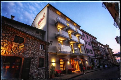 a building with a sign on the side of it at Hotel Miro' in Garda