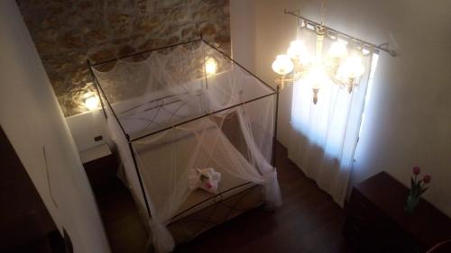 a room with a glass shelf with lights on it at Casetta degli Etruschi ALLOGGIO TURISTICO in Allumiere