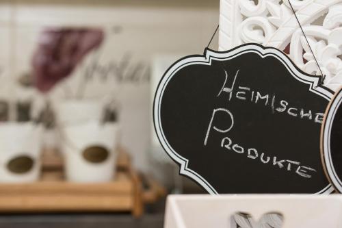 a chalkboard sign that says haram scramble roastery at Pension Magdalena in Altossiach