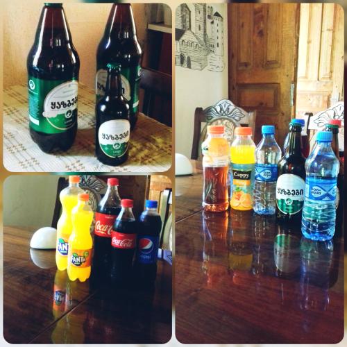 two pictures of different types of bottles on a table at Marina's guest house in Lentekhi