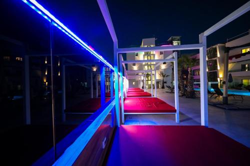 a room with red and blue lights on a balcony at Boutique Apartments Blitz in Bibinje