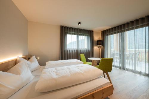 Katil atau katil-katil dalam bilik di Aparthotel Abiná Lana Höhe