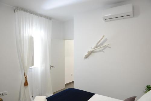 Postel nebo postele na pokoji v ubytování LUZ DEL FARO