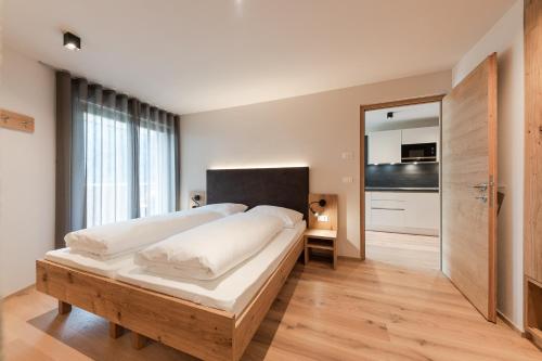 Katil atau katil-katil dalam bilik di Aparthotel Abiná Lana Höhe