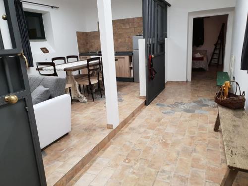 a room with a kitchen and a living room at Suite le Scuderie a "le Moline" vita in fattoria in Vetralla