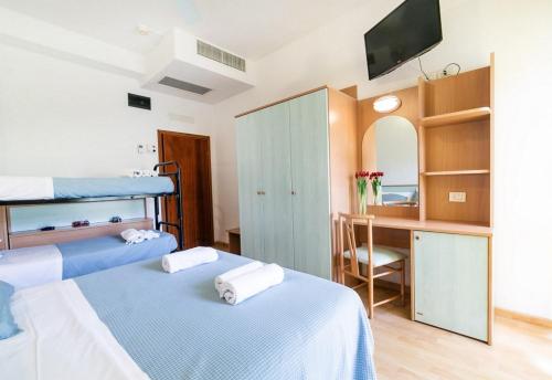 Postel nebo postele na pokoji v ubytování Hotel Augusta