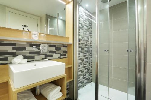 Ванная комната в Jardins de Mademoiselle Hôtel & Spa