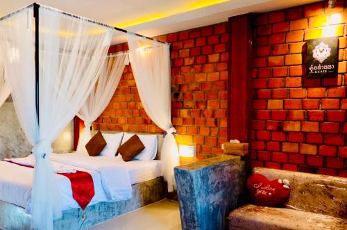 Postel nebo postele na pokoji v ubytování Khum Lanna Boutique Hotel