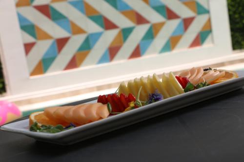 a plate of different types of sushi on a table at FCH Hotel Expo Adults only in Guadalajara