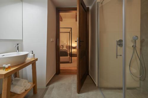 a bathroom with a sink and a glass shower at Pension Kristian by KH in Český Krumlov