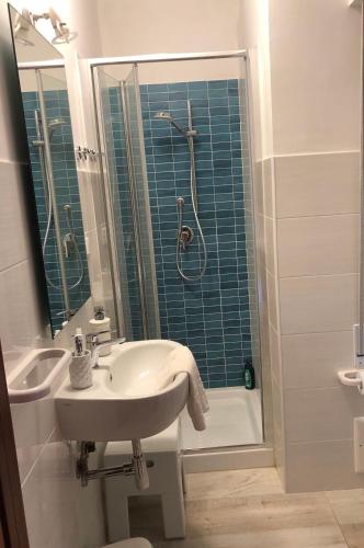 a bathroom with a sink and a shower at Appartamenti Cala Azzurra in Scopello