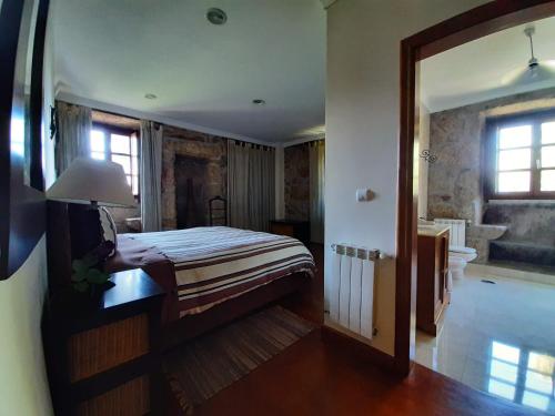En eller flere senger på et rom på Casa do Cerrado