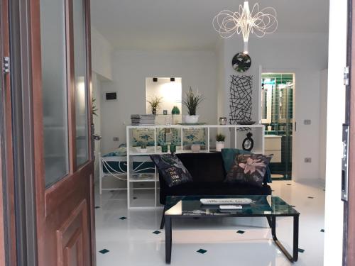 a living room with a couch and a table at Apartments Paris in Umag