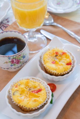 three pies on a white plate with a cup of coffee at Beaconsfield Bed and Breakfast - Victoria in Victoria