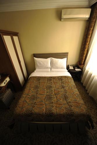 Ένα ή περισσότερα κρεβάτια σε δωμάτιο στο Ak Efe Hotel EDİRNE