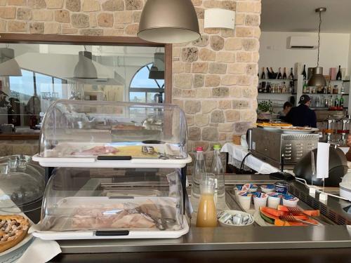 a kitchen with a counter with food on it at Tenuta Lamborghini Golf & Resort in Panicale