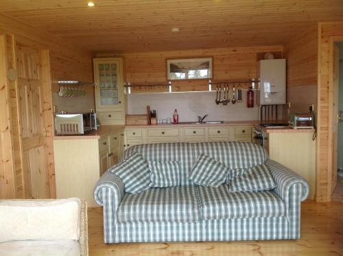 a living room with a couch in a kitchen at Orme View Lodges in Bangor