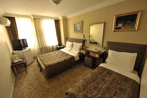 Ένα ή περισσότερα κρεβάτια σε δωμάτιο στο Ak Efe Hotel EDİRNE