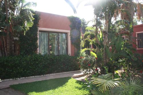 a house with a garden in front of it at 100% Fun in Tarifa