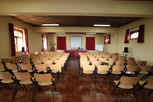 a large room with chairs and a table in it at INATEL Luso in Luso