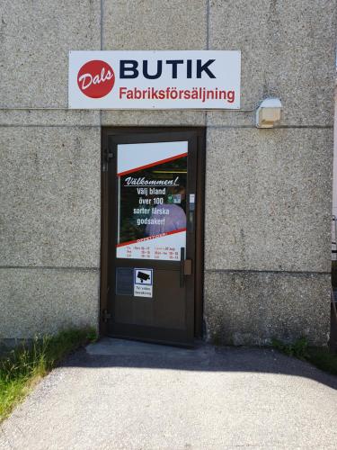 a door to a building with a sign on it at Valhalla bengtfors Private house in Bengtsfors