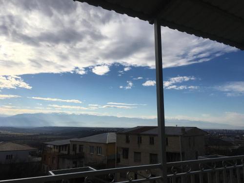 a view of a cloudy sky from a balcony at Guest House T&N in Kutaisi