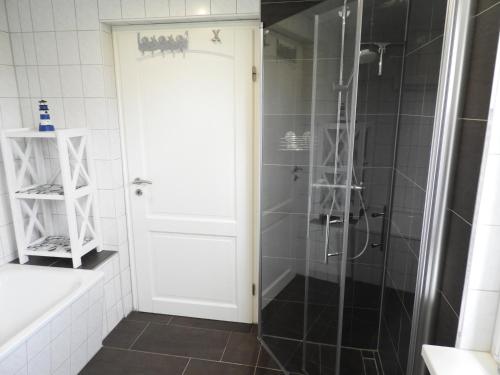 a bathroom with a shower and a glass door at Idyll im Land der 1000 Seen in Liessow