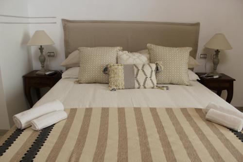 a bedroom with a large bed with pillows at Il Trappeto in Vieste