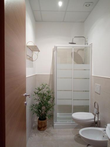 a bathroom with a shower and a toilet and a sink at Silvi d'aMare in Silvi Marina