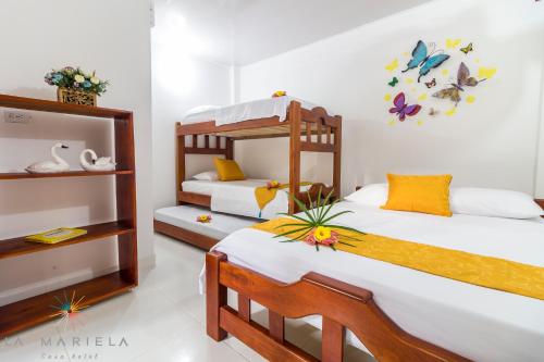 a bedroom with two bunk beds in it at Casa Hotel La Mariela in Zapzurro