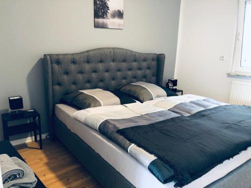 Кровать или кровати в номере Ferienwohnung am Berg