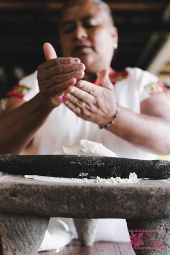 a woman giving a thumbs up while holding her hands at Hotel San Jorge in Tlatlauquitepec