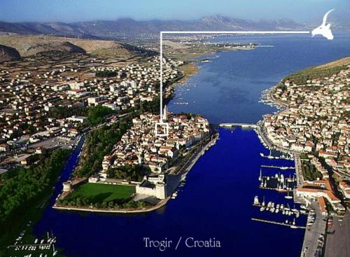 an aerial view of a city with a large body of water at Heritage Hotel Tragos in Trogir