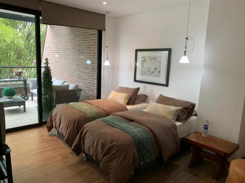 Un pat sau paturi într-o cameră la La Martina