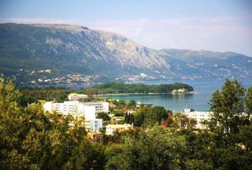 a view of a city and a body of water at Marialice in Dassia