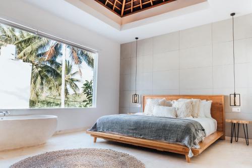Ένα ή περισσότερα κρεβάτια σε δωμάτιο στο Kabila Villas