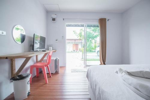 Postel nebo postele na pokoji v ubytování Pak Dee Resort