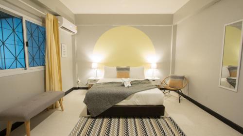 En eller flere senge i et værelse på Neveu Premier Residence : Ratchada