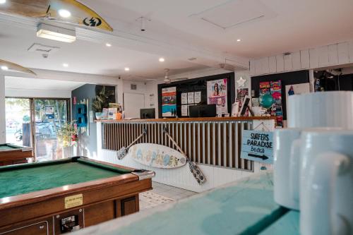 a store with a pool table in a room at Budds In Surfers Backpackers in Gold Coast