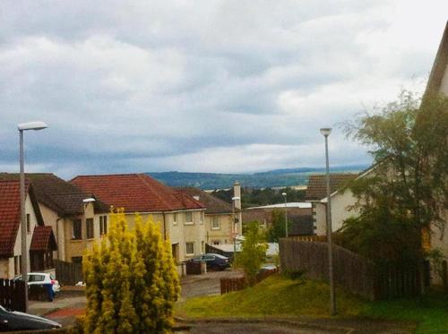 a residential neighbourhood with houses and a street with cars at Taigh d'Luxe in Inverness