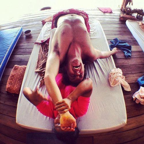 a man laying on a raft in a pool at Shiralea Backpackers Resort in Haad Yao