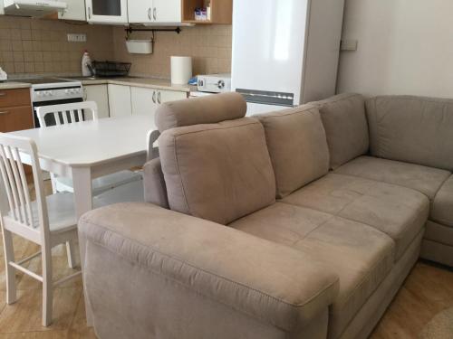 a living room with a couch and a table at JUDIA in Litomyšl