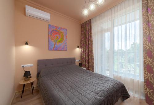 Ένα ή περισσότερα κρεβάτια σε δωμάτιο στο Green Apartments