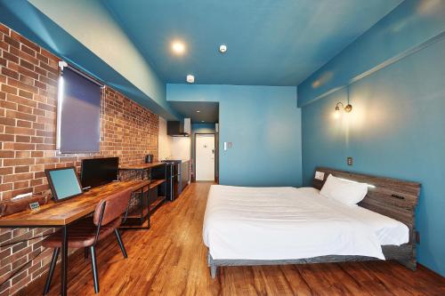 מיטה או מיטות בחדר ב-Hotel 385