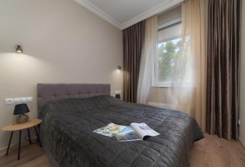 Ένα ή περισσότερα κρεβάτια σε δωμάτιο στο Green Apartments