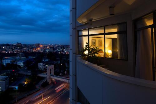 a view of a city at night from a building at Nairobi Safari Club by Swiss-Belhotel in Nairobi