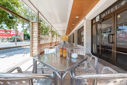 a table and chairs sitting on a patio at Hotel Canadá in Tarragona