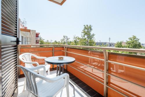a balcony with a table and chairs on it at Hotel Canadá in Tarragona