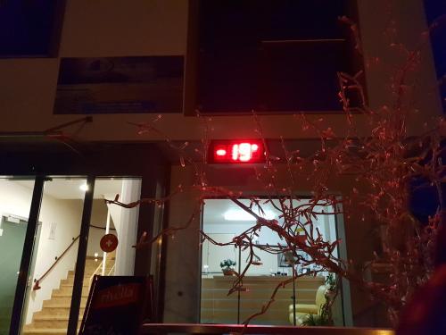 a red light on the side of a building at Hotel Astoria in Ulrichen